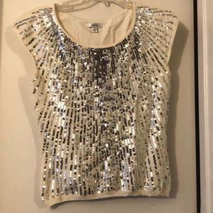 cream sparkly shirt